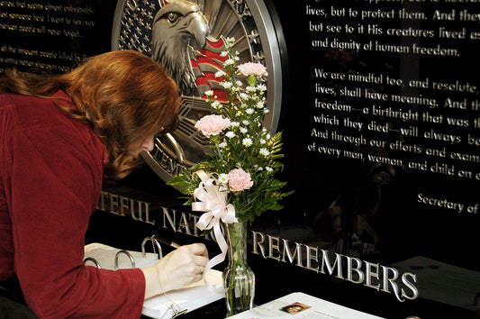 Lady Signing Guest Book at Funeral